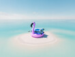 pink flamingo pool float and a blue suitcase on a small sandbank in the middle of a vast clear turquoise ocean. Concept of a dreamy escape to paradise.