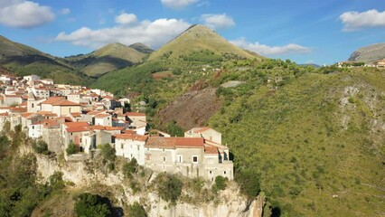 Wall Mural - The traditional village of Tortora on top of its mountain in Europe, Italy, Calabria in summer on a sunny day.