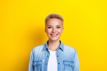 Wall Mural - Photo portrait of lovely young lady look up empty space promo dressed stylish denim garment isolated on yellow color background