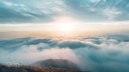Wall Mural - serene sunrise above cloud-covered mountains in a tranquil landscape