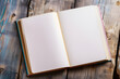 © Bonsales - Open notebook with plain sheets placed on rural wooden table. Creative space for students to note down reminders and craft spontaneous sketches