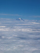 Snowy Mountain Peak Poking About Cloud Layer From Aircraft