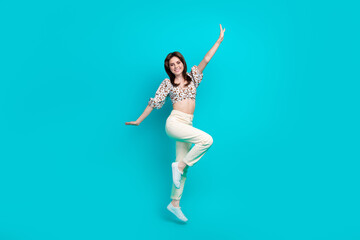 Canvas Print - Full length photo of cute impressed woman wear flower print top jumping high arms sides isolated teal color background