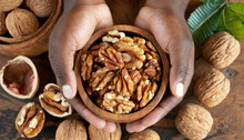 Close-up Of Two Cupped Hands Holding A Wooden Bowl Full Of Shelled Walnuts. Generative Ai.