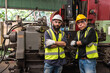 © Jack Tamrong - Factory engineer man and senior technician colleague working together in industrial heavy machinery
