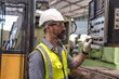 © Jack Tamrong - Portrait serious Caucasian engineer man controlling switch board in industrial factory