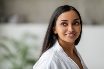 Wall Mural - Closeup of beautiful indian woman wearing bathrobe at spa