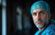 Determined surgeon in scrubs with a focused expression in a hospital