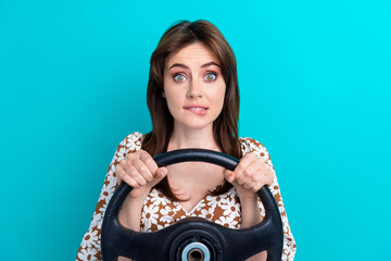 Canvas Print - Photo of doubtful scared lady dressed flower print top biting lip driving automobile isolated turquoise color background