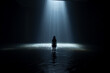 In absolute darkness at night, a girl up to her waist in water goes to a shining rectangle of light in the depths 