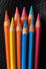 Aufkleber - A striking arrangement of fluorescent pencils on a luxurious, black leather surface, creating a bold visual impact,