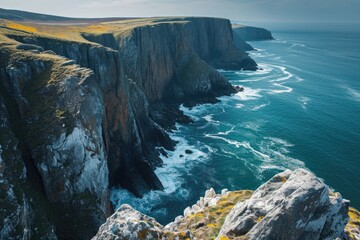 Wall Mural - A stunning view of towering cliffs that provide a dramatic backdrop to the expansive ocean, High angle shot of a sweeping sea reaching dramatic cliff edges, AI Generated