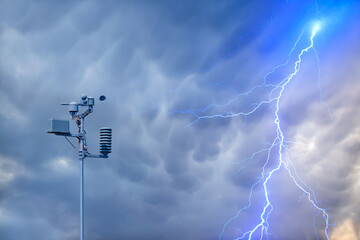 Wall Mural - weather station automatic measurement of weather parameters with stormy sky