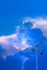 Wall Mural - weather station automatic measurement of weather parameters with stormy sky