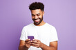 © AI_images - Happy man with phone on Lavender studio background