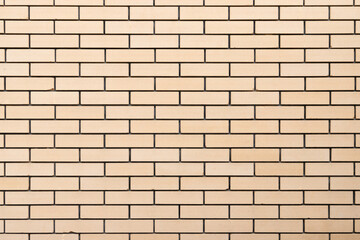 Wall Mural - Yellow brick wall, front view, background texture