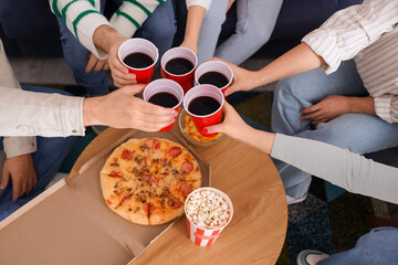 Group of young friends with beer and snacks resting at home, closeup