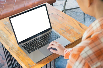 Wall Mural - Woman using blank laptop in the cafe.