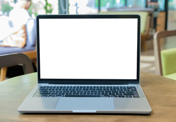 Wall Mural - Laptop with blank screen on a table in the cafe.