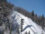 Fototapeta Tulipany - Closeup of the top of giant ski jump at Planica Ski Resort on a Sunny Winter Day