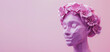abstract low poly female head with decorative floral crown in pastel pink tones, international women's day concept with copy space for text 