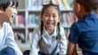 © Ilja - Diverse group of happy kids sitting in circle around teacher in library listening to storytime