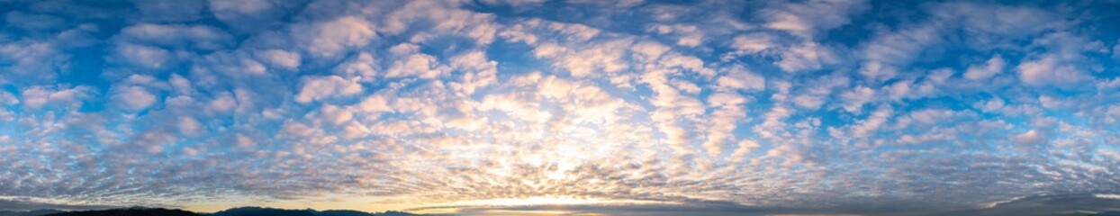 Wall Mural - Panoramic View of Cloudscape during a colorful sunset or sunrise.