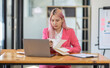 © David - Accountant asian women at desk using laptop document archives on folders papers and calculator for accounting