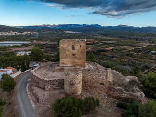 Sticker - Aerial view of Torres Torres medieval castle ruin with square keep and semi circular towers near Valencia Spain with dramatic sky