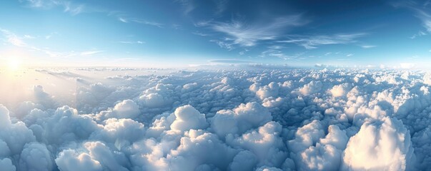 Wall Mural - a stunning aerial panorama of dense cumulus clouds bathed in sunlight, with a clear blue sky above.