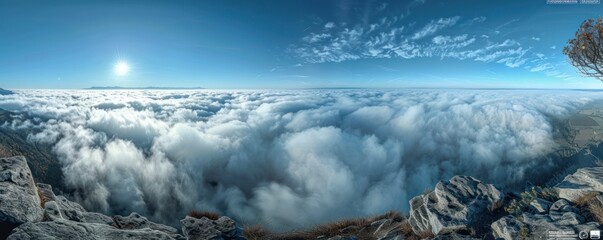 Wall Mural - a stunning aerial panorama of dense cumulus clouds bathed in sunlight, with a clear blue sky above.