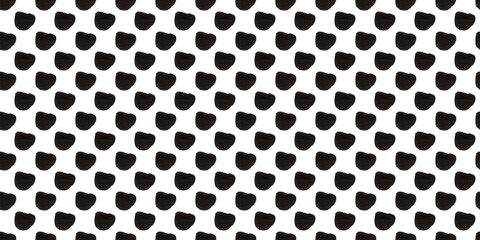 Wall Mural - Seamless polka dot pattern: Vector illustration with small black freeform dots on a white backdrop. Creative texture of chaotic triangular and round shapes. Cute dotted wrapping paper sample.