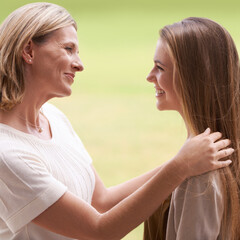 Poster - Women, mother and daughter with embrace, happy and mature person with connection, care and love. Mom, girl and family with bonding, reunion and support with relationship, smile and together by grass