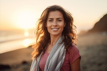 Sticker - Portrait of beautiful woman on the beach at sunrise. Healthy lifestyle.