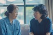 Room with Asian caregiver and senior woman