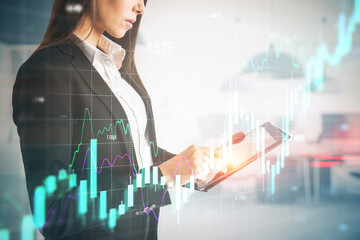 Poster - Businesswoman hands using tablet with growing forex chart on blurry office interior background. Financial investment and economy concept. Double exposure.