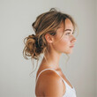 © Nelover - woman from behind, wishful, breeze in her hair, low bun, messy little hair, whe is wearing white slip dress, she has ginger light brown hair, her head is tilted upwards and to the side, studio shot