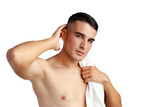Fototapeta Mapy - Young smiling man with towel on shoulders posing at camera on white background