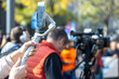 © wellphoto - Mobile journalist filming media event with a smartphone. Citizen journalism concept.