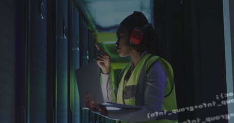 Poster - African american female server room worker using headphones