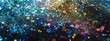 A dazzling multicolor glitter background that sparkles with a variety of vibrant colors scattered across a dark surface.