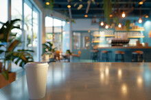 Takeaway coffee cup in cozy modern coffee shop setting for casual meetings or freelancing work.