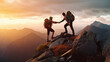 © redflower - Climbers help friends reach the top of a mountain