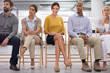 © Y.A./peopleimages.com - Business, people and waiting room for interview, recruitment and thinking of opportunity. Woman, men and portrait of professional worker on chair for human resources, job and hiring process in career