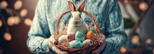 A Man Holds A Basket Of Easter Eggs With Rabbit In His Hands