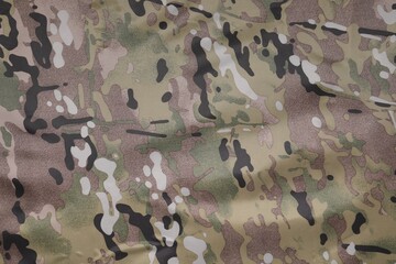 Texture of camouflage fabric as background, top view