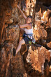 © AW/peopleimages.com - Woman, mountain and rock climbing for exercise in outdoors, challenge and rope for training. Female person, cliff and extreme sport for fitness or workout, hiking and support to explore in nature