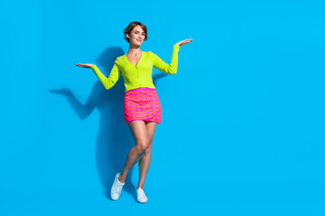 Sticker - Full body size photo of young lady dressed mini skirt with cardigan show balance with advantages products isolated on cyan color background