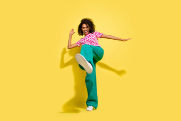 Sticker - Full body portrait of crazy cheerful lady dance leg kick shoe sole empty space isolated on yellow color background