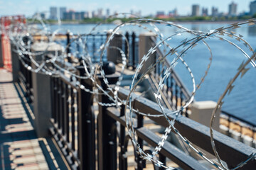 Fence with barbed wire. No entry. The border is guarded